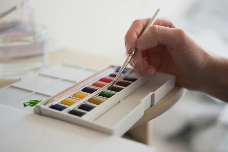 A brush over a watercolour pan set