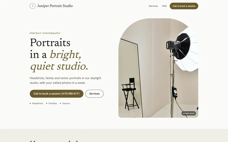 The first screen of the Juniper Portrait Studio sample site: Portraits in a bright, quiet studio, beside a studio light.